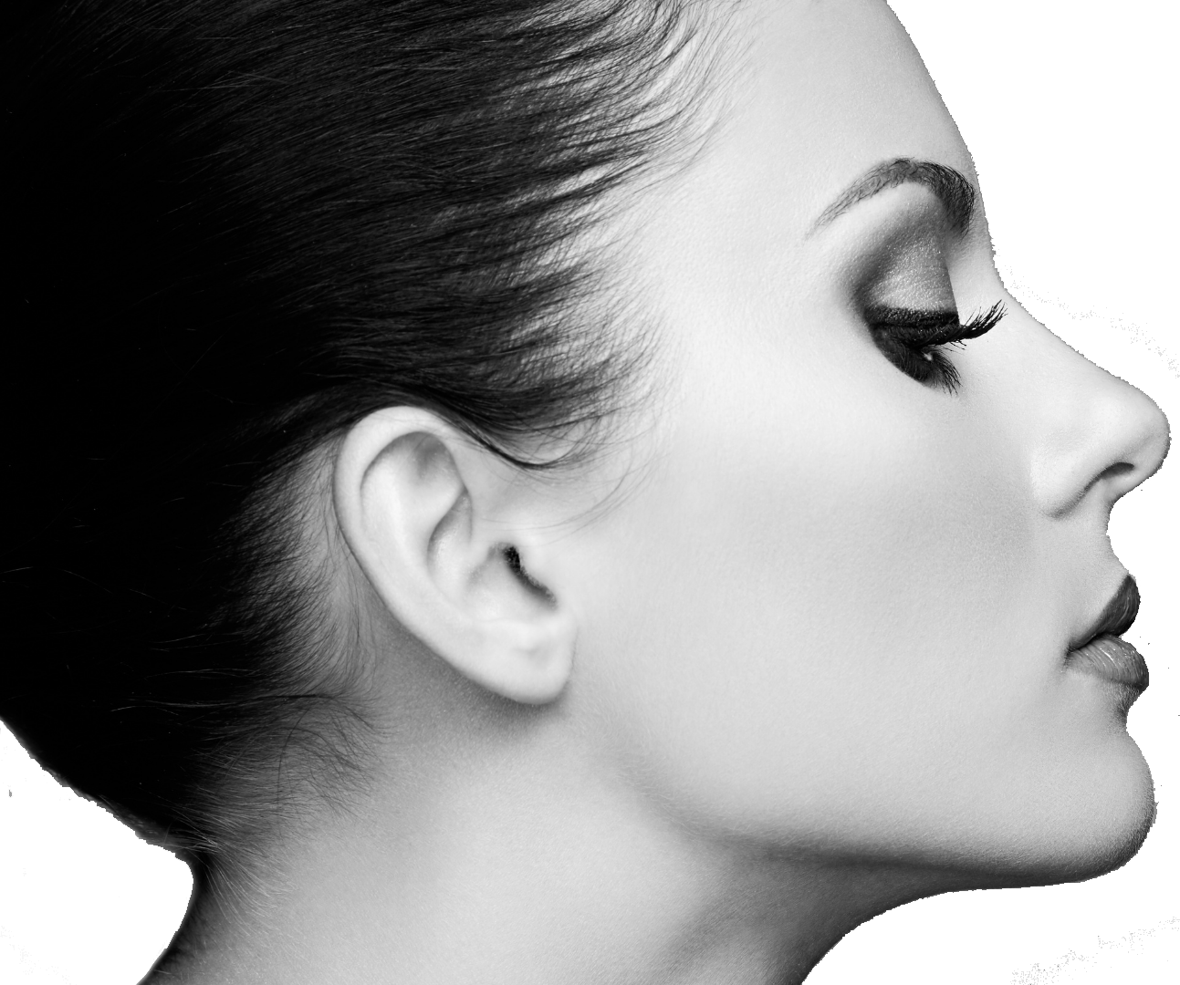 A black and white image close up of a woman's face with eye lashes.